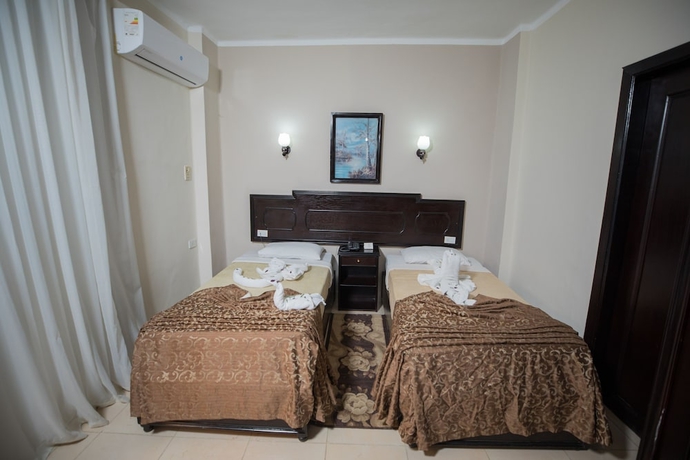 Imagen de la habitación del Hotel Sand Beach Resort, Hurghada. Foto 5
