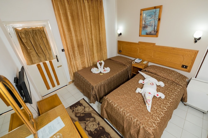 Imagen de la habitación del Hotel Sand Beach Resort, Hurghada. Foto 12