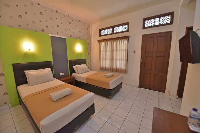 Imagen de la habitación del Hotel Sandat Kuta. Foto 17