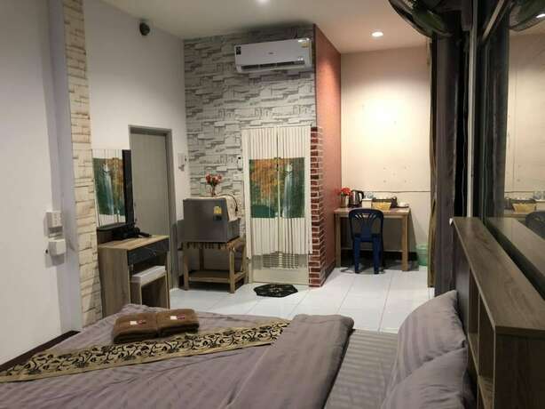 Imagen de la habitación del Hotel Sandee Place Chomthong. Foto 30