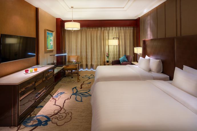 Imagen de la habitación del Hotel Sanding New Century Grand. Foto 2