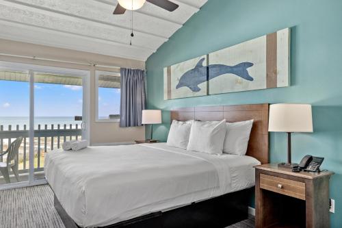 Imagen de la habitación del Hotel Sandpiper Beacon Beach Resort. Foto 17