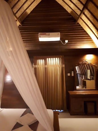 Imagen de la habitación del Hotel Sandy Beach Bungalows. Foto 7