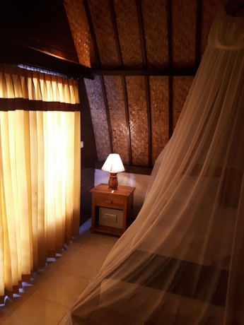 Imagen de la habitación del Hotel Sandy Beach Bungalows. Foto 10
