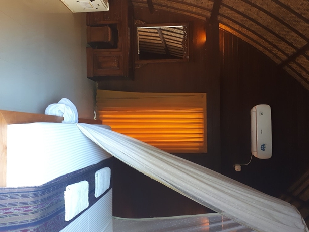 Imagen de la habitación del Hotel Sandy Beach Bungalows. Foto 11