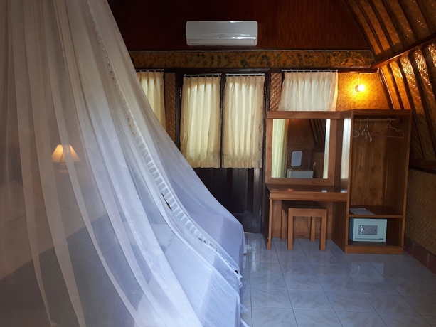 Imagen de la habitación del Hotel Sandy Beach Bungalows. Foto 13