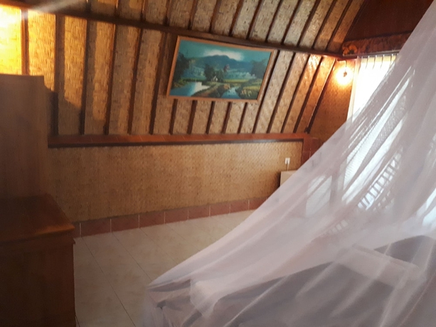 Imagen de la habitación del Hotel Sandy Beach Bungalows. Foto 14