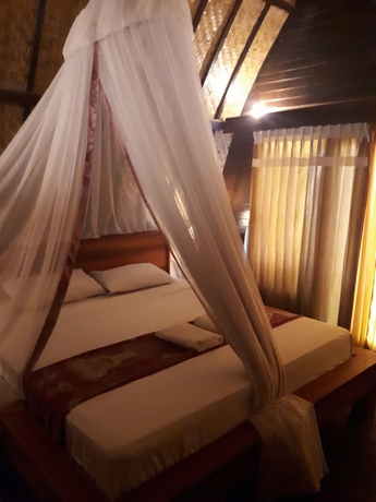 Imagen de la habitación del Hotel Sandy Beach Bungalows. Foto 16