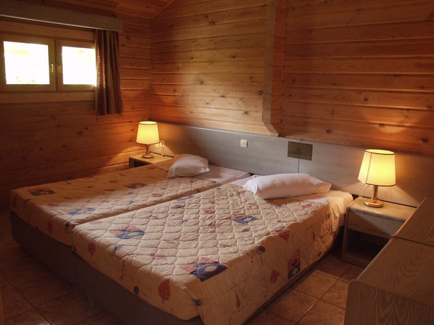 Imagen de la habitación del Hotel Sandy's Studios Apartments and Log Villas. Foto 14