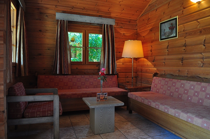 Imagen de la habitación del Hotel Sandy's Studios Apartments and Log Villas. Foto 16