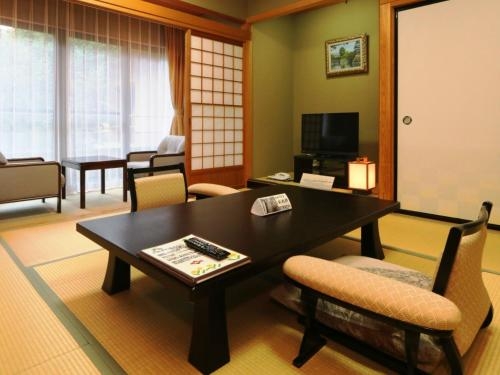 Imagen de la habitación del Hotel Saneikaku. Foto 9