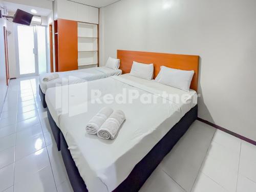 Imagen de la habitación del Hotel Sang Surya GuestHouse Near RS Hasan Sadikin. Foto 17