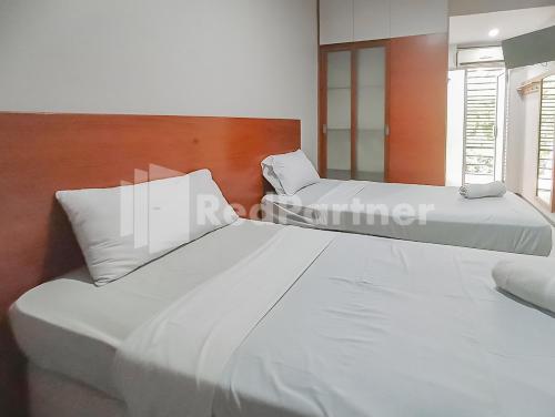 Imagen de la habitación del Hotel Sang Surya GuestHouse Near RS Hasan Sadikin. Foto 19