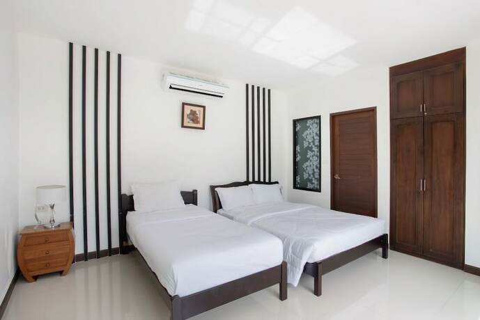 Imagen de la habitación del Hotel Sanga Villas. Foto 18
