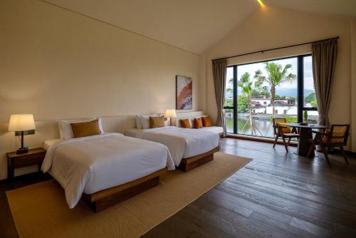 Imagen de la habitación del Hotel Sanhe Daoli Resort. Foto 13