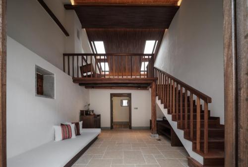 Imagen de la habitación del Hotel Sanhe Daoli Resort. Foto 15