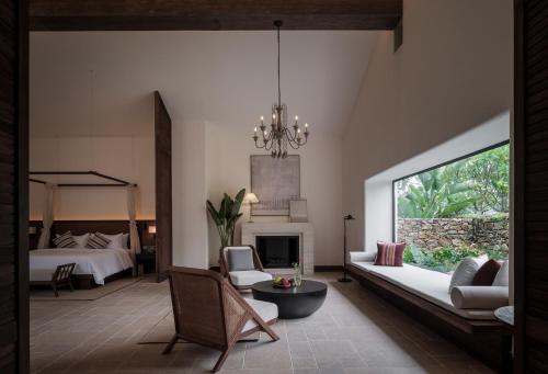 Imagen de la habitación del Hotel Sanhe Daoli Resort. Foto 19