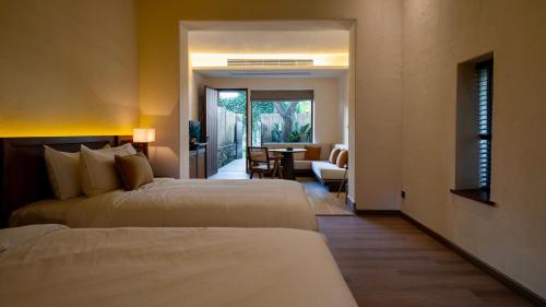 Imagen de la habitación del Hotel Sanhe Daoli Resort. Foto 20