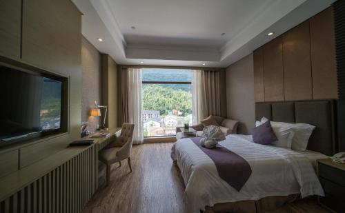 Imagen de la habitación del Hotel Sanqingshan New Century Resort. Foto 9