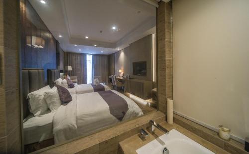 Imagen de la habitación del Hotel Sanqingshan New Century Resort. Foto 10