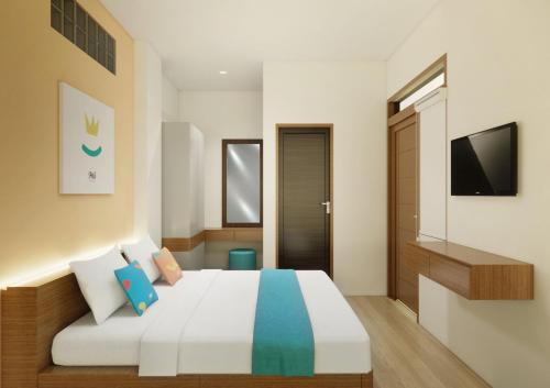 Imagen de la habitación del Hotel Sans Bougenville Lampung. Foto 12