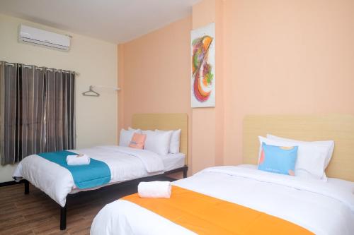 Imagen de la habitación del Hotel Sans City Park Medoho Semarang. Foto 19