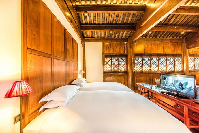 Imagen de la habitación del Hotel Sanshengwuer Zeyun Inns. Foto 13