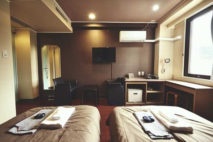Imagen de la habitación del Hotel Sansui Global Inn. Foto 2