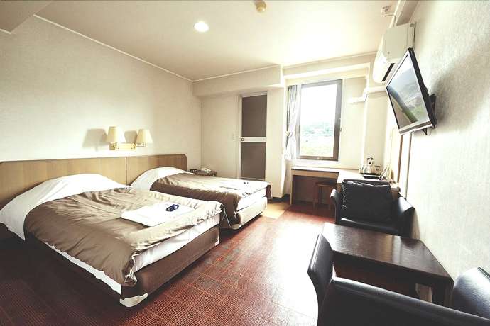 Imagen de la habitación del Hotel Sansui Global Inn. Foto 15