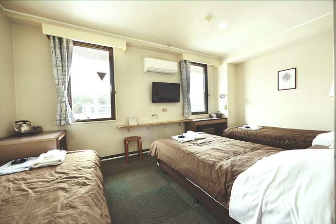 Imagen de la habitación del Hotel Sansui Global Inn. Foto 16