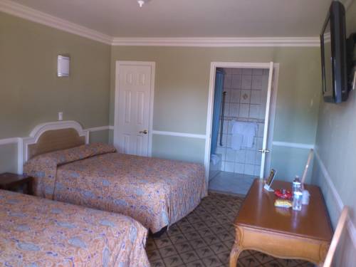 Imagen de la habitación del Hotel Santa Ana Travel Inn. Foto 13