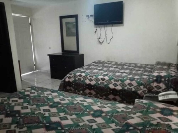 Imagen de la habitación del Hotel Santander Inn and Suites. Foto 8