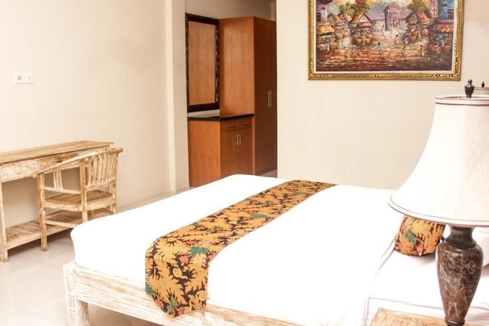 Imagen de la habitación del Hotel Santi HomeStay. Foto 4