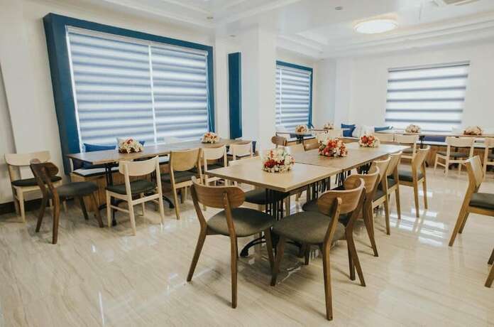 Imagen del bar/restaurante del Hotel Santiago Cove And Restaurant. Foto 12