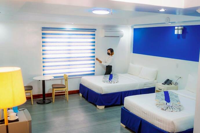 Imagen de la habitación del Hotel Santiago Cove And Restaurant. Foto 14