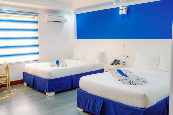 Imagen de la habitación del Hotel Santiago Cove And Restaurant. Foto 15