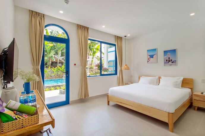 Imagen de la habitación del Hotel Santorin Hoian Villa. Foto 17
