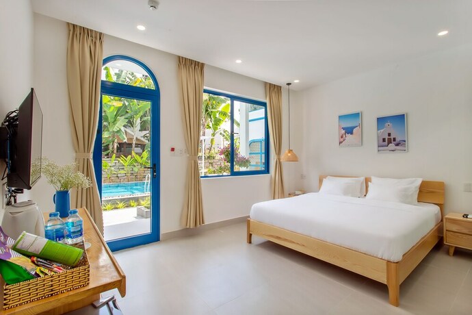 Imagen de la habitación del Hotel Santorin Hoian Villa. Foto 18