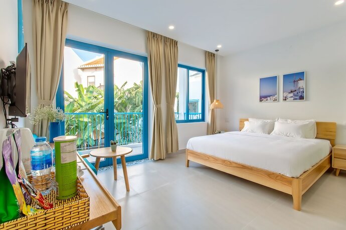 Imagen de la habitación del Hotel Santorin Hoian Villa. Foto 22