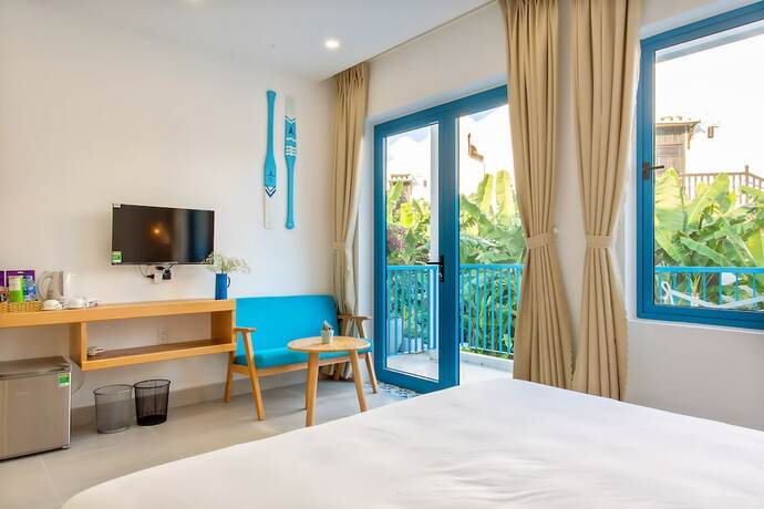 Imagen de la habitación del Hotel Santorin Hoian Villa. Foto 23