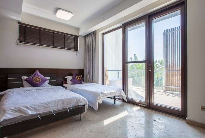 Imagen de la habitación del Hotel Sanya Chenxi Holiday Villa Apartment. Foto 13