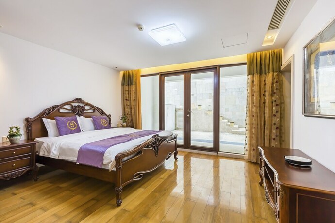 Imagen de la habitación del Hotel Sanya Chenxi Holiday Villa Apartment. Foto 20