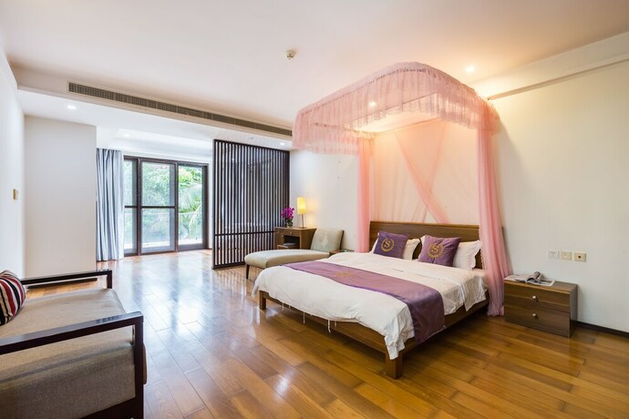 Imagen de la habitación del Hotel Sanya Chenxi Holiday Villa Apartment. Foto 22
