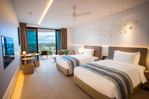 Imagen de la habitación del Hotel Sanya Conifer Resort. Foto 2