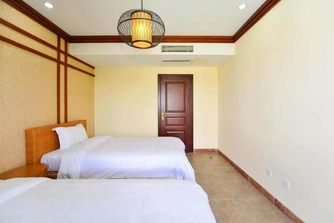 Imagen de la habitación del Hotel Sanya Jiahua Shunze Resort Apartment. Foto 38