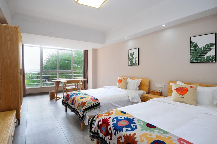 Imagen de la habitación del Hotel Sanya Kairuilai Sea View Holiday. Foto 8