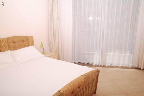 Imagen de la habitación del Hotel Sanya Palmena International Apartment. Foto 6