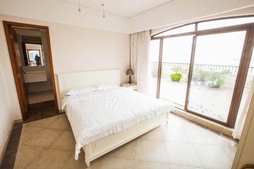 Imagen de la habitación del Hotel Sanya Palmena International Apartment. Foto 10