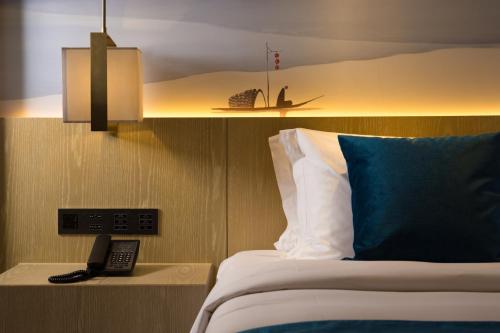 Imagen de la habitación del Hotel Sanya Runde Wetland Park. Foto 8