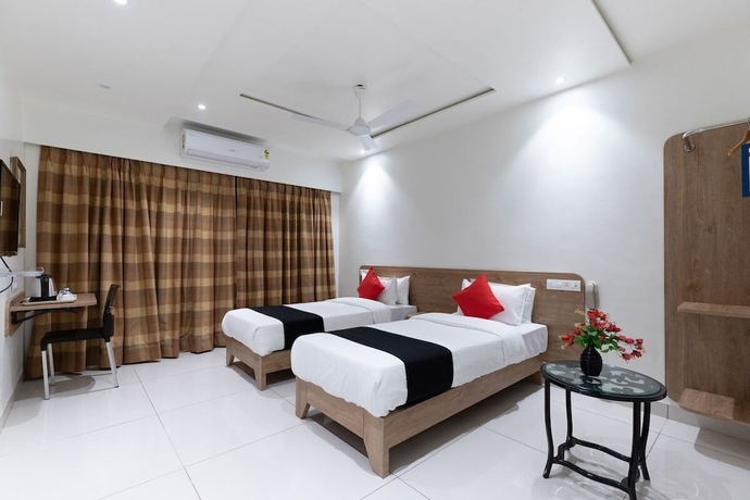 Imagen de la habitación del Hotel Sapphero Akshar Inn- Jamnagar. Foto 4